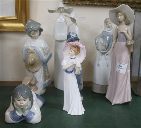 A collection of mixed Lladro, Nao and Doulton figures